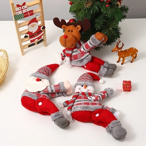 Detailed view of Santa, Reindeer, and Snowman plush curtain buckles in festive holiday scene
