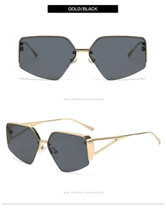 Detail view of gold metal sunglasses with black grey lenses and hollowed-out temples