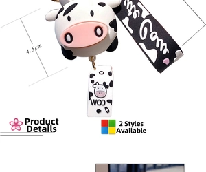 Detail view of cartoon cow keychain with mini milk box charm and PVC wrist strap