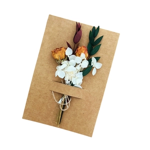 Handmade kraft greeting card with preserved dried flowers for teacher gift