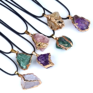 Natural irregular raw crystal pendant necklace with gold plated edge on black cord