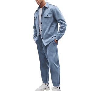 Detail of light blue faux suede jacket set showing texture, collar, and black buttons