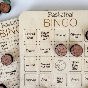 Detailed close-up of wooden basketball BINGO game boards with engraved sports terms