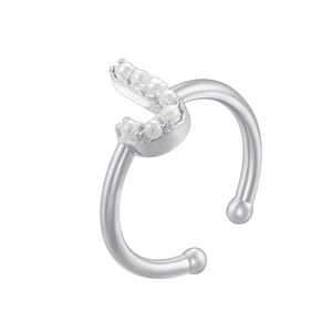 Detailed view of silver U-shaped ear cuff with embedded small pearls on a white background