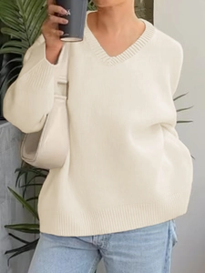 Beige V-neck knitted sweater in a loose fit, elegant casual style for women