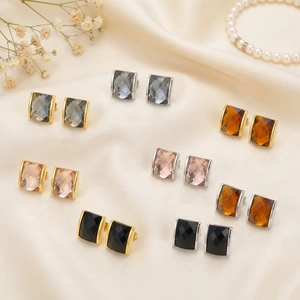 Detailed display of colorful rectangular faceted glass earrings with 18K gold plated base