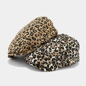 Vintage leopard print beret with adjustable metal buckle in classic brown and white