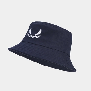 Close-up of navy blue bucket hat featuring white ghost face embroidery for Halloween