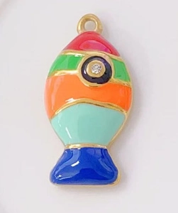 Detailed view of fish-shaped pendant with colorful enamel stripes and gold edging