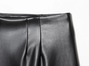 Vue macro détaillée de la taille en similicuir noir avec des textures plissées élégantes