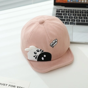 Detail of pink corduroy baby baseball cap with cute zebra embroidery and soft brim
