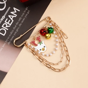 Detail of Christmas reindeer brooch with multi-layer chains, pearls and colorful bells