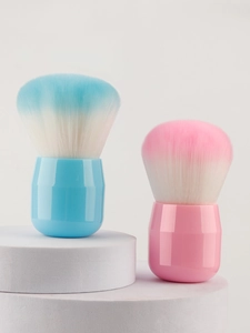Detail of macaron-colored mushroom foundation brushes with soft gradient synthetic bristles