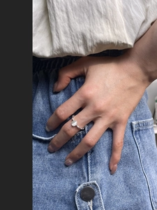 Minimalist 925 sterling silver open ring with white round gemstone on hand