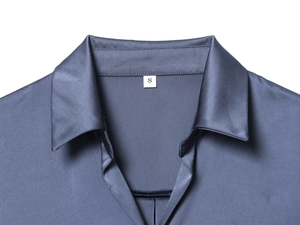 Detail view of smooth blue satin shirt collar with macro texture and size S label