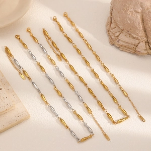 Minimalist fish-shaped stainless steel chain link necklace and bracelet set in gold finish