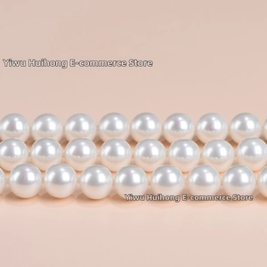 Macro shot of 2x4mm white natural stone disc beads showing premium luster and texture