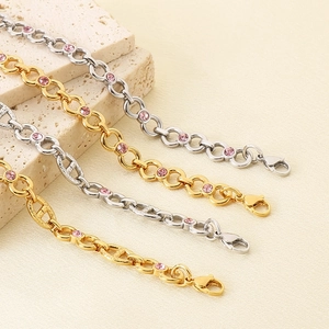 Golden and silver anchor chain bracelets featuring vibrant pink zircon gemstones for women