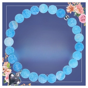 Detailed blue agate 8mm stone bracelet with silver heart charm on floral greeting card