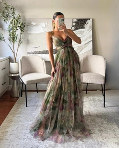 Detail of floral mesh maxi dress featuring deep V-neck and stylish waist cut-outs