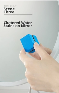 Macro view of blue honeycomb cleaning sponge removing water stains on a vanity mirror