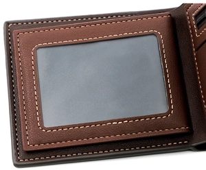 Detail of men's brown tri-fold wallet showing clear ID window and contrast stitching