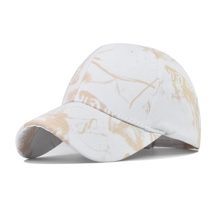 Close-up of the breathable cotton fabric texture and tie-dye camo pattern on baseball cap
