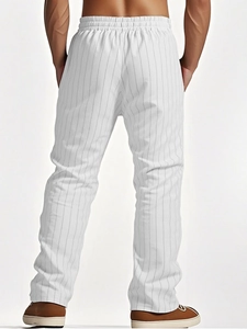 Detail view of men's linen striped casual pants showing vertical stripes and drawstring waist
