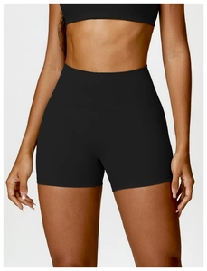 Vue détaillée du short de yoga noir taille haute montrant le gainage et la coupe sans couture