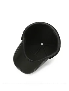 Detail of warm thickened fleece lining and premium leather brim on men winter flat cap