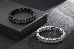 Detail of black and silver titanium steel bike chain bracelets with fold-over clasps