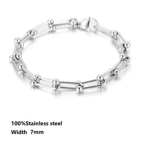 Detail of 7mm stainless steel link bracelet featuring U-link chain and bead accents