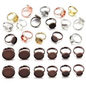 Macro display of adjustable round tray ring bases in various metal finishes for DIY jewelry