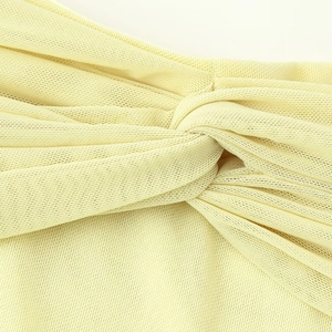 Elegant pale yellow mesh tube dress with stylish front twist detail and waist cinching