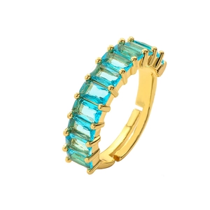 Adjustable gold open ring featuring light blue rectangular zircon stones on white background