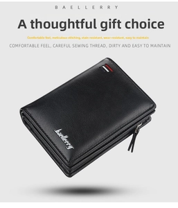 Detail view of black leather wallet showing fine texture, stitching and metallic logo