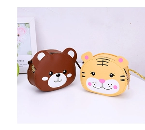 Detail of cute bear and tiger PU leather kids crossbody bags with woven shoulder straps