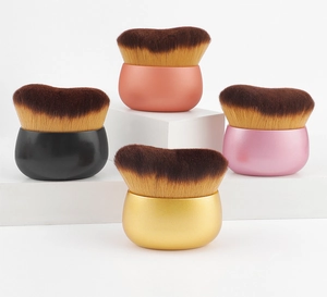 Detailed macro view of dense synthetic bristles and heart-shaped makeup brush heads