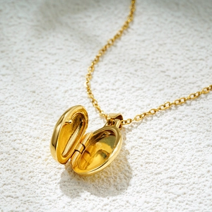 Vintage 18K gold plated oval locket necklace with delicate chain in open position