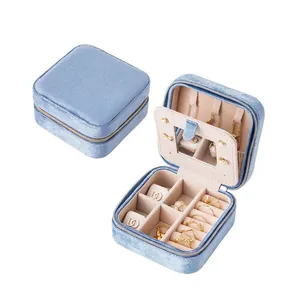 Portable velvet jewelry organizer with mirror, ring slots and necklace hooks in blue