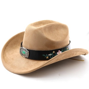 Detailed embroidery and turquoise buckle on a camel suede western cowboy hat band
