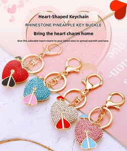 Detail of crystal heart keychains with arrows and lobster clasps in multiple colors