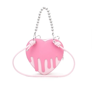 Pink heart-shaped handbag with dripping leather design and silver beaded handle