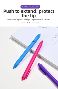 Close-up of pastel retractable gel pens in macaron colors on a minimalist desk setup
