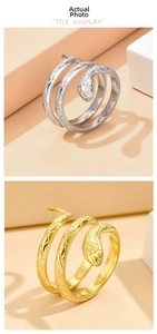 Detail of snake rings in gold and silver finish showing intricate scale textures