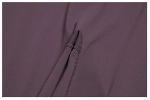 Detailed close-up of high-quality four-needle six-thread stitching on purple yoga wear