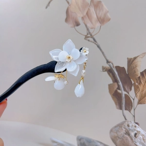 Elegant white magnolia wood hairpin with pearl tassel charm in a Zen aesthetic style