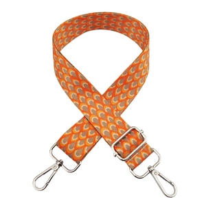 Detail of adjustable 3.8cm shoulder strap with orange wave pattern and silver hooks