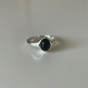 Detail shot of a vintage 925 sterling silver ring featuring a black oval onyx stone