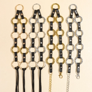 Set of four punk leather waist chains with gold and silver rings and fringe details